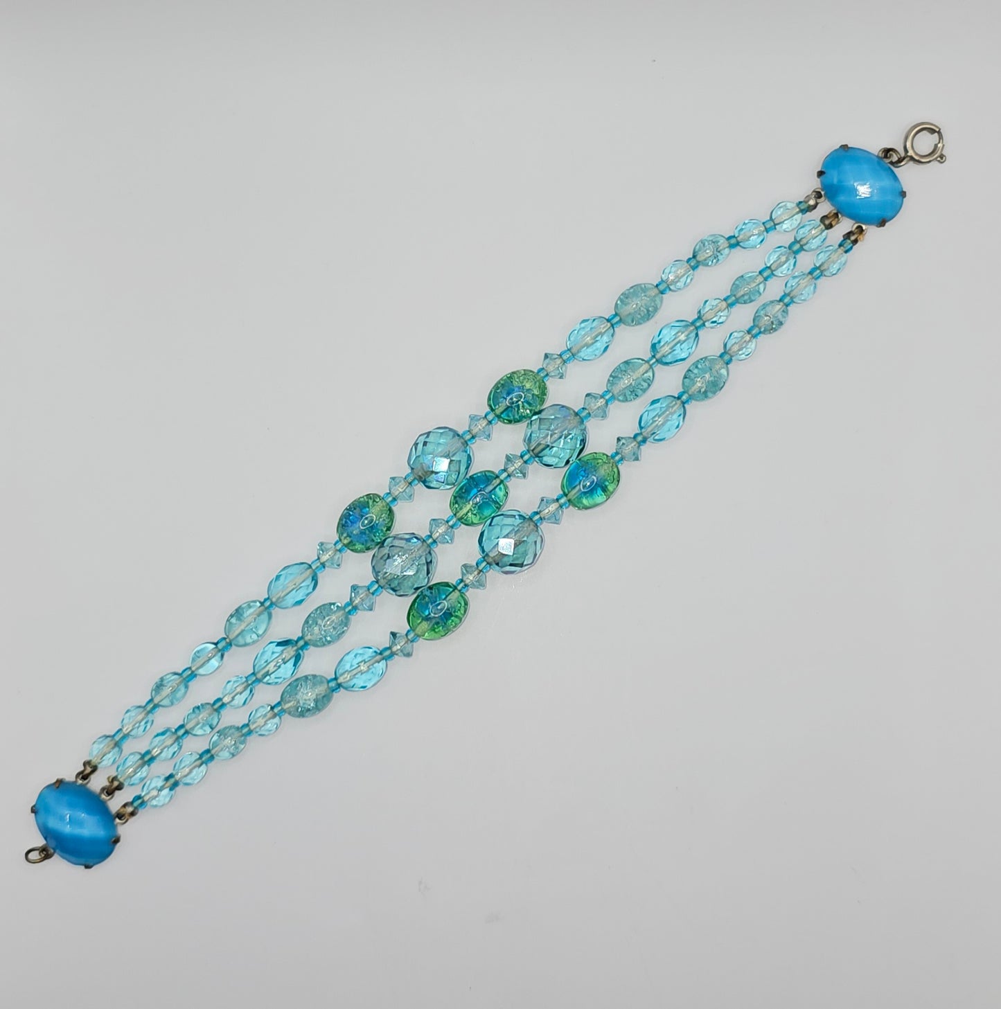 9" Aquamarine colored glass faced bead bracelet