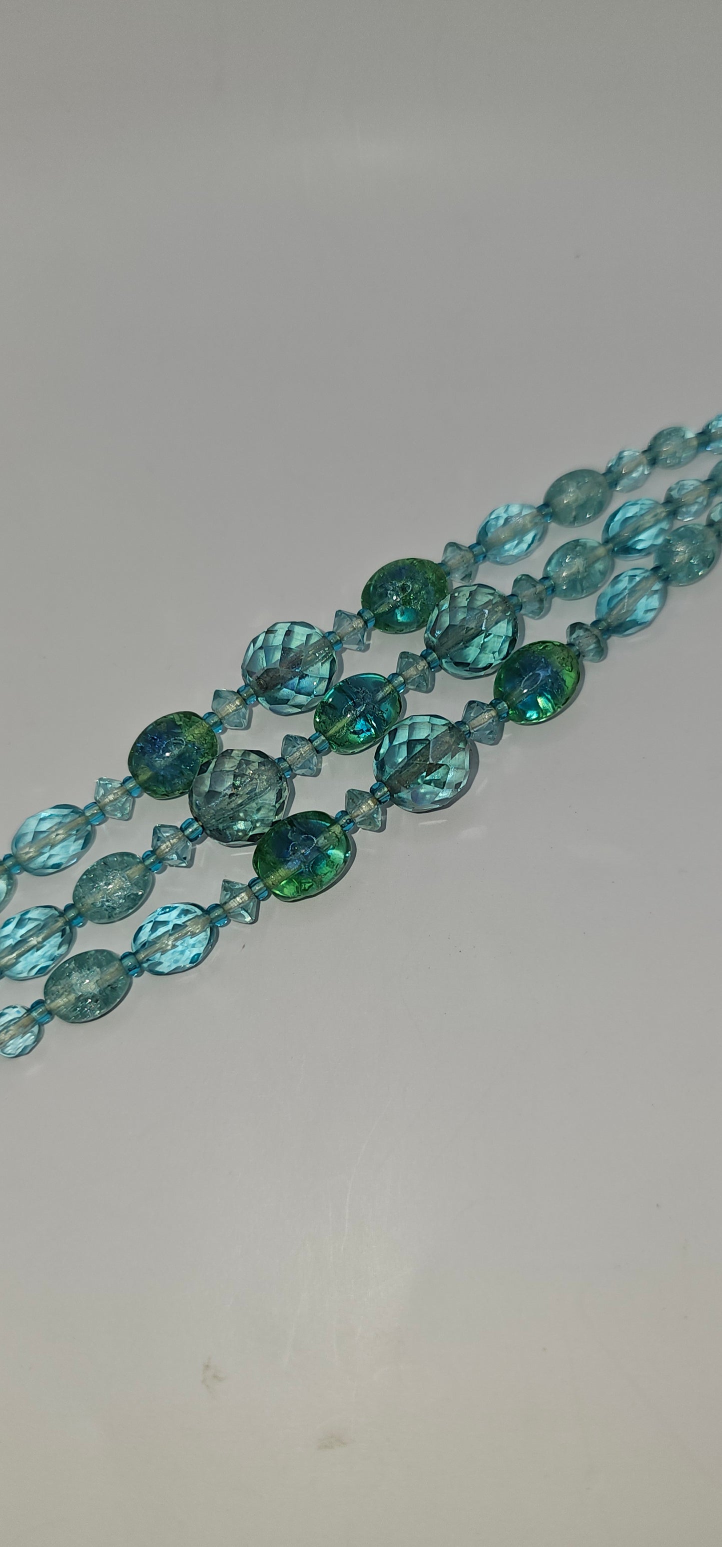 9" Aquamarine colored glass faced bead bracelet