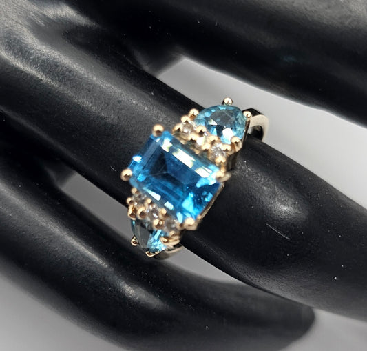 Blue topaz and diamond ring 14k yellow gold