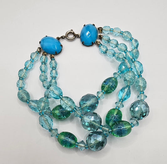9" Aquamarine colored glass faced bead bracelet